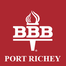 Better Business Bureau Logo , has a torch and the background is red with the words Port Richey